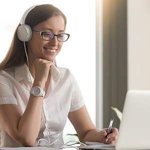 Woman listening to webinar